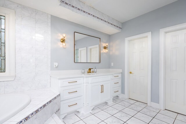 5410 River Oak Way, Phenix City, AL 36867 - bathroom with vanity, a garden tub, and tile patterned flooring