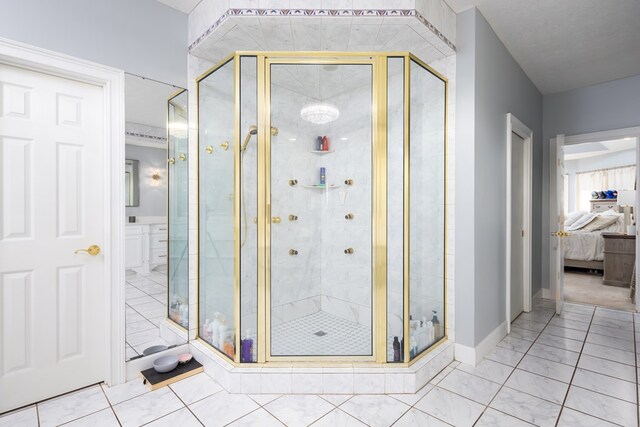 5410 River Oak Way, Phenix City, AL 36867 - ensuite bathroom featuring a shower stall, baseboards, and marble finish floors