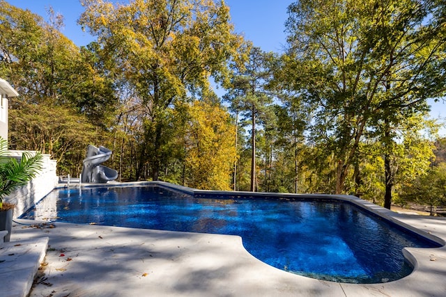 view of pool featuring a water slide