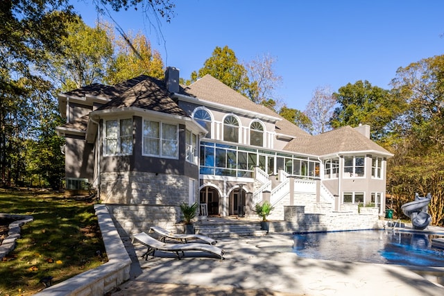 view of front of property with a sunroom