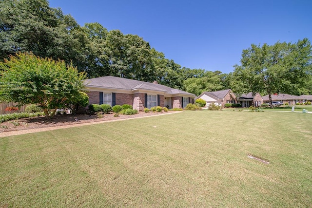 3985 Castlewood Pkwy, Columbus, GA 31907 - ranch-style home with a front lawn and a chimney