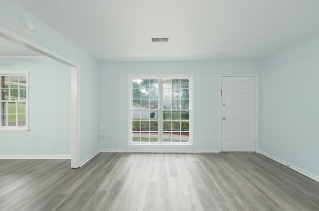 5011 Edo Ct, Columbus, GA 31907 - empty room with wood finished floors, plenty of natural light, and a smoke detector