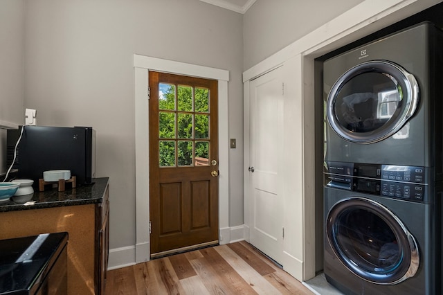 1917 Dimon St, Columbus, GA 31906 - laundry area featuring stacked washer / dryer, light wood finished floors, and crown molding