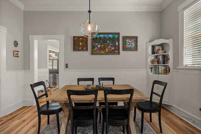 1917 Dimon St, Columbus, GA 31906 - dining area featuring light wood-style flooring, healthy amount of natural light, a wainscoted wall, and crown molding