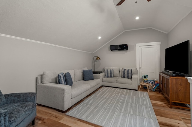 1917 Dimon St, Columbus, GA 31906 - living room with vaulted ceiling, light wood-style flooring, a ceiling fan, a wall mounted air conditioner, and recessed lighting