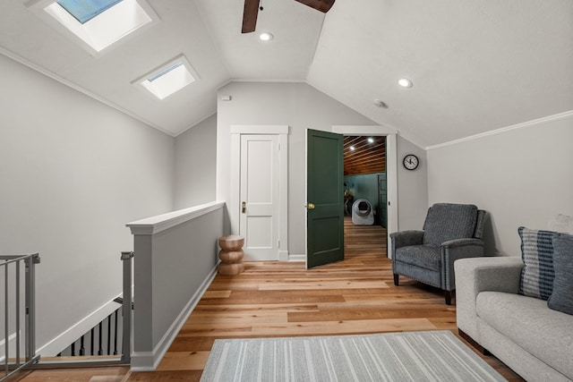 1917 Dimon St, Columbus, GA 31906 - living area with an upstairs landing, lofted ceiling, light wood finished floors, a skylight, and recessed lighting
