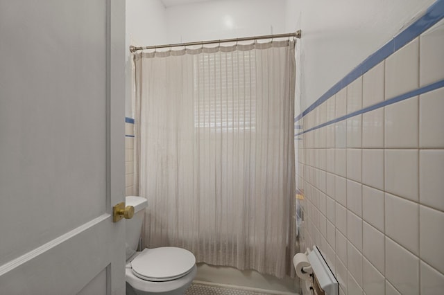 1917 Dimon St, Columbus, GA 31906 - full bathroom featuring shower / bath combo with shower curtain and tile walls