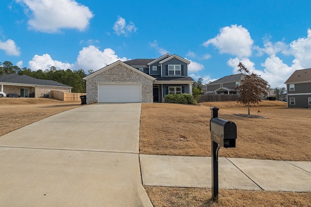 view of front of property with a garage and a front yard