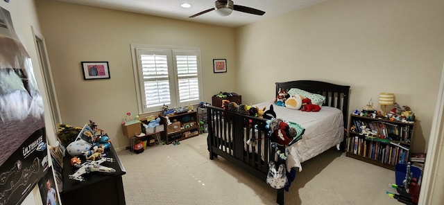 carpeted bedroom with a ceiling fan