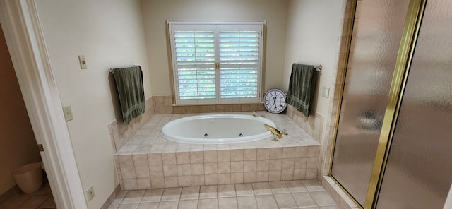 full bathroom featuring a stall shower, toilet, tile patterned flooring, and a jetted tub