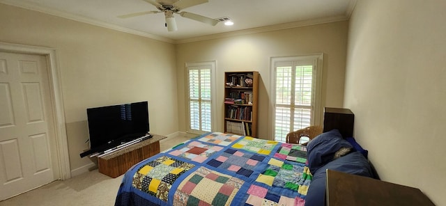 bedroom featuring baseboards, ornamental molding, light carpet, and ceiling fan