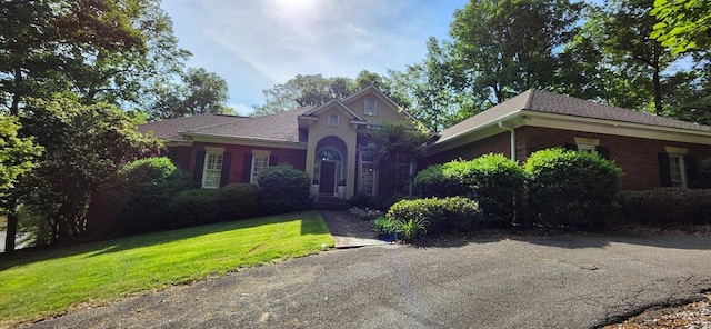 view of front of home with a front lawn