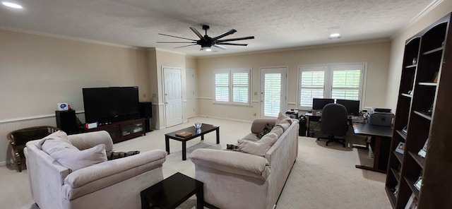 living room featuring a ceiling fan, a textured ceiling, light colored carpet, ornamental molding, and recessed lighting