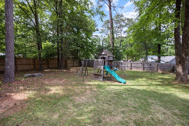 view of play area featuring a fenced backyard and a lawn