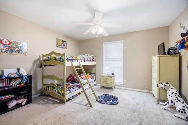 bedroom with carpet floors, baseboards, and a ceiling fan