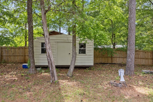 view of shed with a fenced backyard