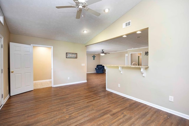7635 Edgewater Dr, Columbus, GA 31904 - kitchen with a peninsula, black appliances, white cabinets, crown molding, and a sink