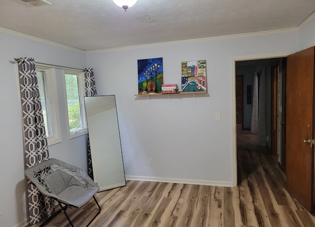 7505 Beaver Run Rd, Midland, GA 31820 - living area with crown molding, wood finished floors, and a textured ceiling