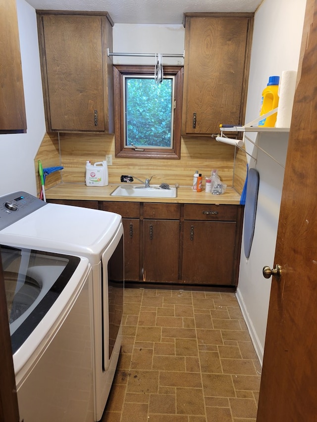 7505 Beaver Run Rd, Midland, GA 31820 - washroom featuring washing machine and clothes dryer, cabinet space, and brick patterned flooring