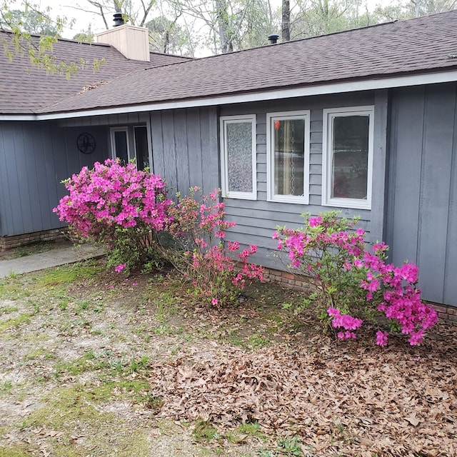 7505 Beaver Run Rd, Midland, GA 31820 - view of side of property with a chimney and a shingled roof
