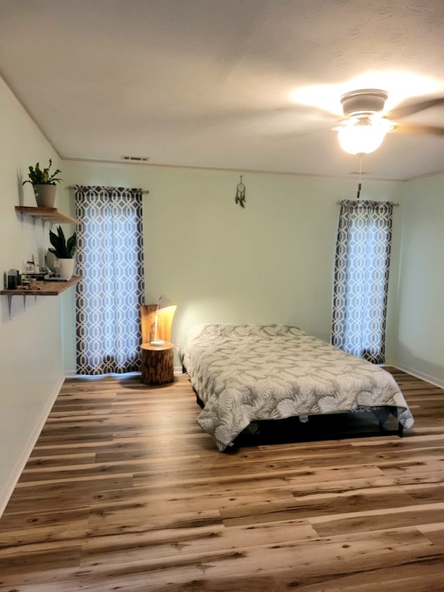 7505 Beaver Run Rd, Midland, GA 31820 - bedroom with wood finished floors and ceiling fan