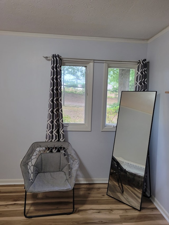 7505 Beaver Run Rd, Midland, GA 31820 - sitting room with ornamental molding, wood finished floors, and a textured ceiling