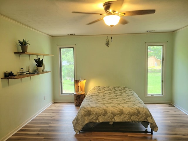 7505 Beaver Run Rd, Midland, GA 31820 - bedroom with crown molding, wood finished floors, and a ceiling fan