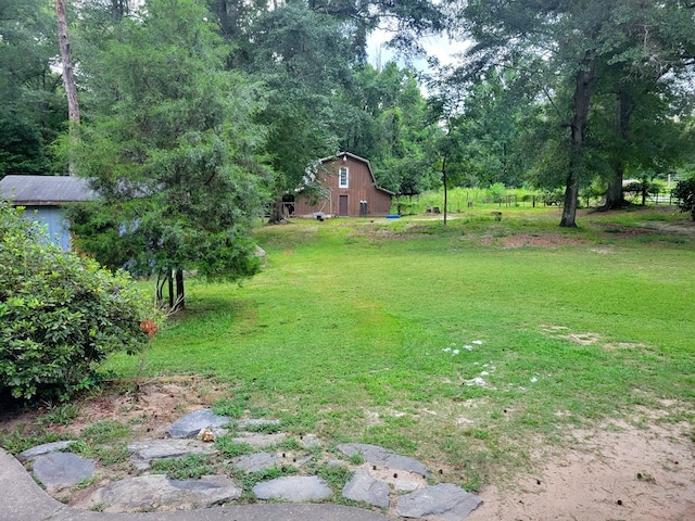 7505 Beaver Run Rd, Midland, GA 31820 - view of grassy yard featuring a barn and an outdoor structure