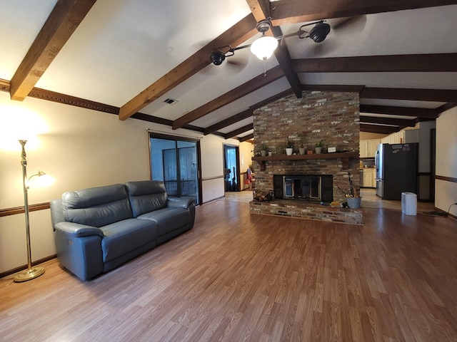 7505 Beaver Run Rd, Midland, GA 31820 - living area featuring ceiling fan, wood finished floors, and a fireplace