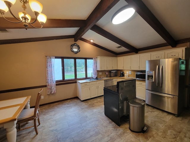 7505 Beaver Run Rd, Midland, GA 31820 - kitchen with stainless steel appliances, a chandelier, white cabinetry, decorative light fixtures, and a kitchen island