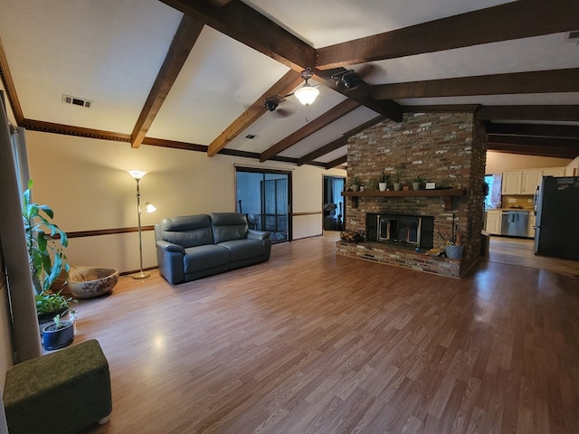 7505 Beaver Run Rd, Midland, GA 31820 - living room featuring wood finished floors, ceiling fan, and a brick fireplace