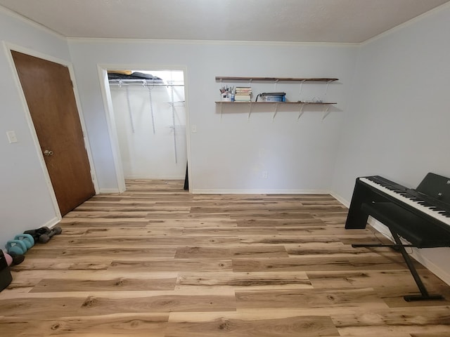7505 Beaver Run Rd, Midland, GA 31820 - bedroom with light wood-style flooring, ornamental molding, and a closet