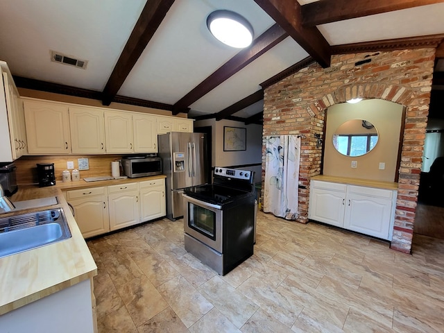7505 Beaver Run Rd, Midland, GA 31820 - kitchen featuring appliances with stainless steel finishes, white cabinetry, and light countertops
