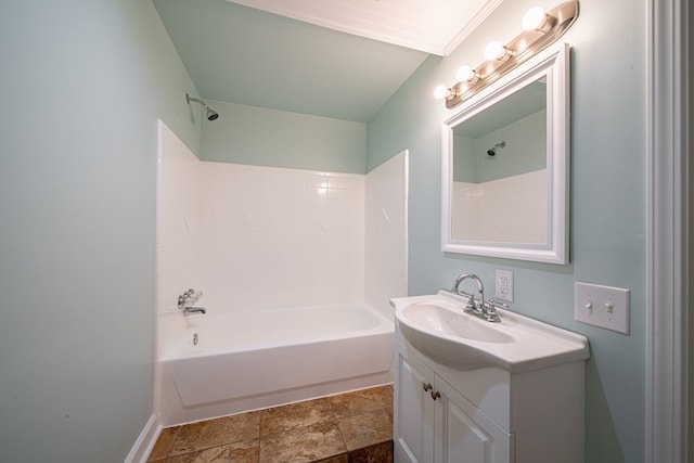 bathroom featuring baseboards, vanity, and  shower combination