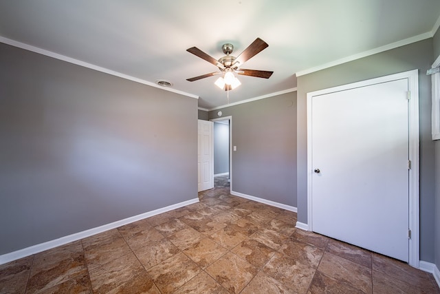 unfurnished bedroom featuring visible vents, ceiling fan, crown molding, and baseboards