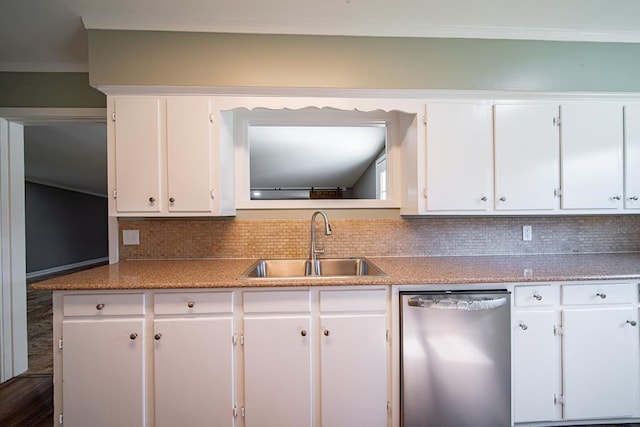 kitchen featuring light countertops, decorative backsplash, stainless steel dishwasher, white cabinets, and a sink