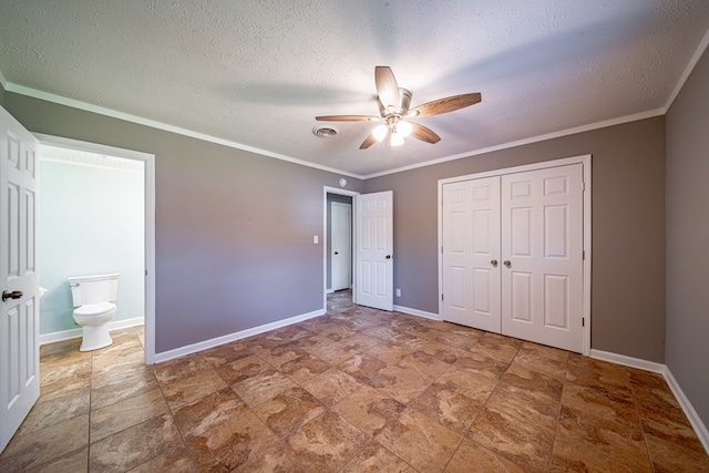 unfurnished bedroom featuring visible vents, crown molding, and baseboards