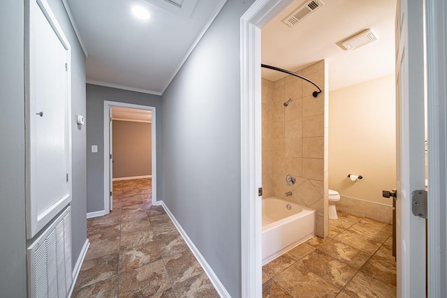 bathroom featuring visible vents, toilet, and ornamental molding