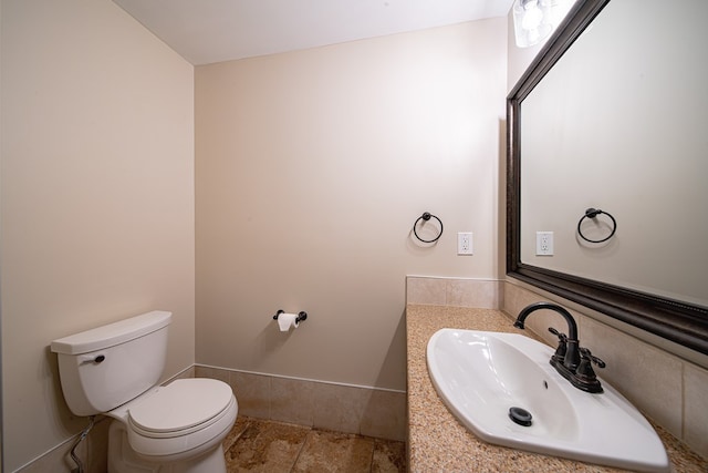 half bath with vanity and toilet