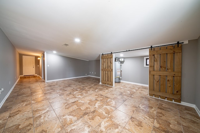 basement featuring visible vents, gas water heater, a barn door, recessed lighting, and baseboards