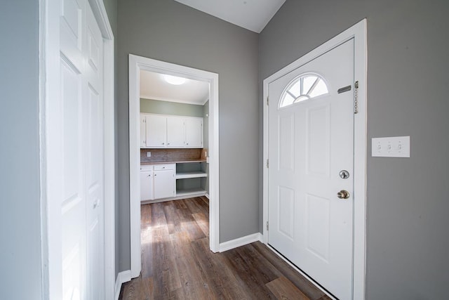 entrance foyer with dark wood-style floors and baseboards