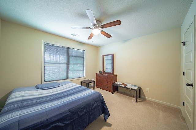 9742 Wooldridge Heights Dr, Fortson, GA 31808 - bedroom featuring ceiling fan, a textured ceiling, light colored carpet, visible vents, and baseboards