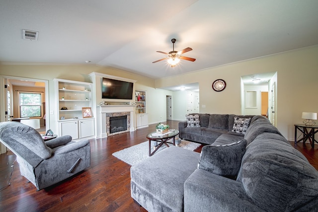 9742 Wooldridge Heights Dr, Fortson, GA 31808 - living area with ceiling fan, dark wood finished floors, a stone fireplace, vaulted ceiling, and visible vents