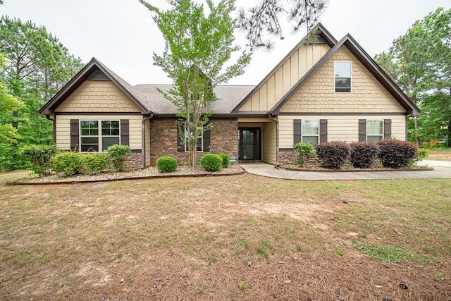 9742 Wooldridge Heights Dr, Fortson, GA 31808 - view of front of property featuring board and batten siding, a front yard, and stone siding