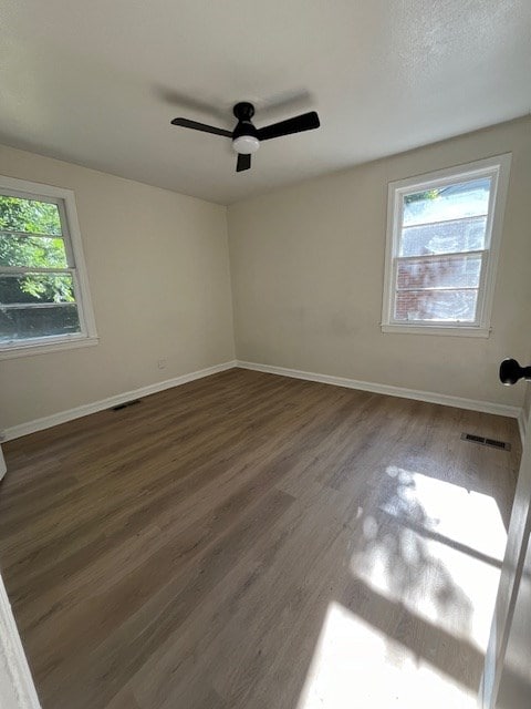 3015 Walker St, Columbus, GA 31903 - empty room with dark wood-style floors and a ceiling fan