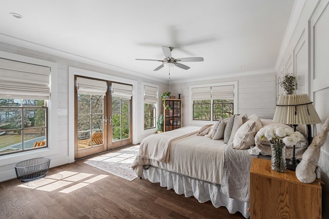 bedroom featuring wood finished floors, ceiling fan, access to exterior, french doors, and crown molding