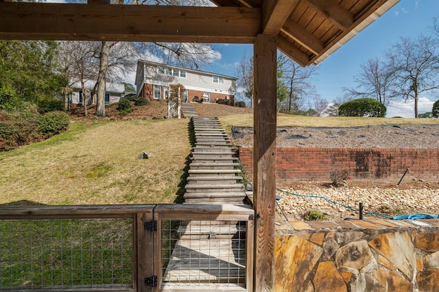 view of yard with a fenced front yard and a gate