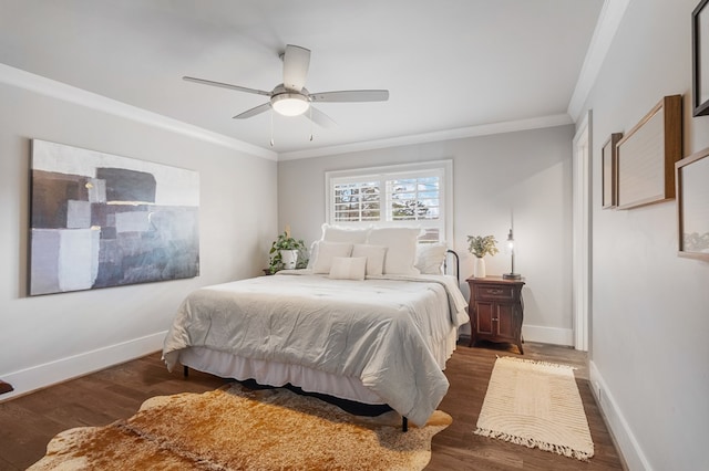 bedroom featuring baseboards, wood finished floors, a ceiling fan, and ornamental molding