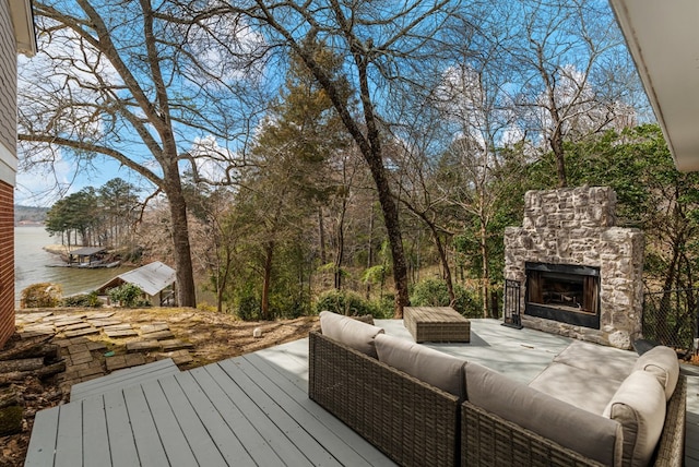 wooden deck featuring an outdoor living space with a fireplace