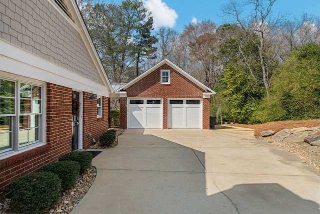 view of home's exterior with a standing seam roof, brick siding, and metal roof